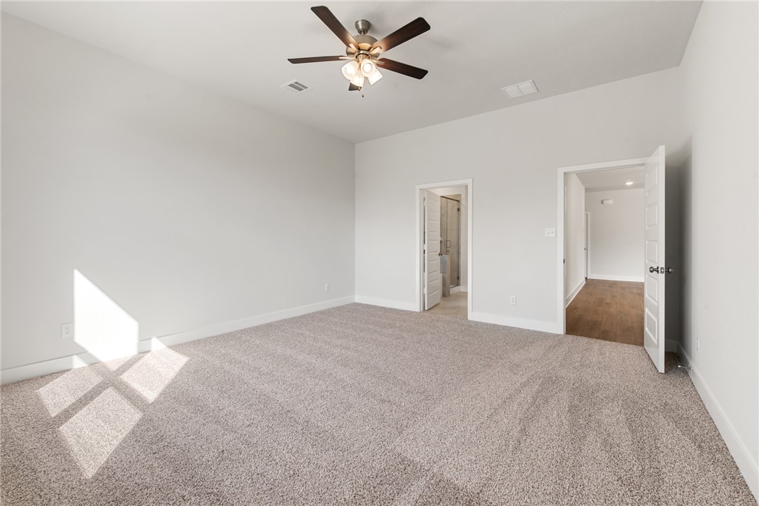 8452 Muir Wood Loop Anderson, TX 77830 - Photo 24 of 48 a view of a big room with carpet