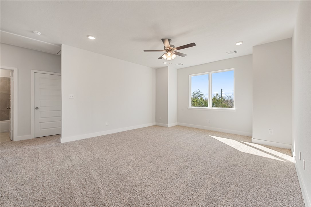8452 Muir Wood Loop Anderson, TX 77830 - Photo 31 of 48 a view of an empty room with a window