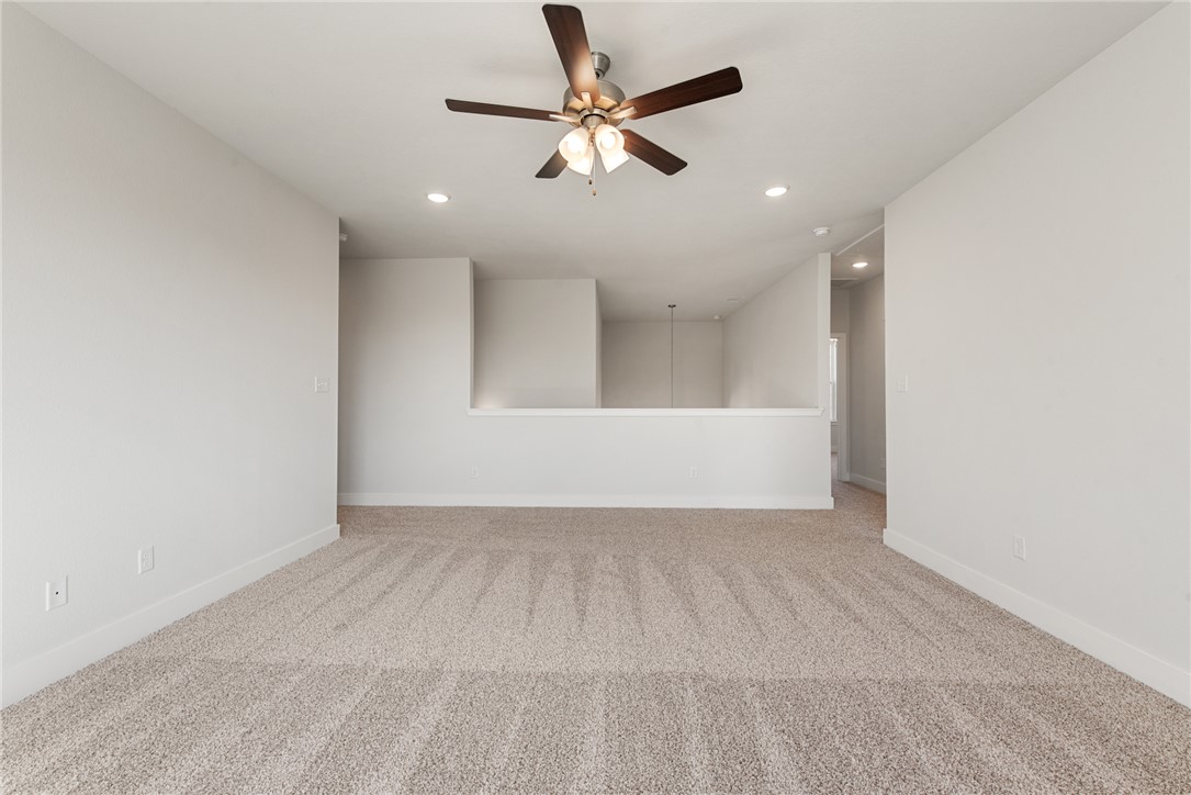 8452 Muir Wood Loop Anderson, TX 77830 - Photo 32 of 48 an empty room with fan and windows