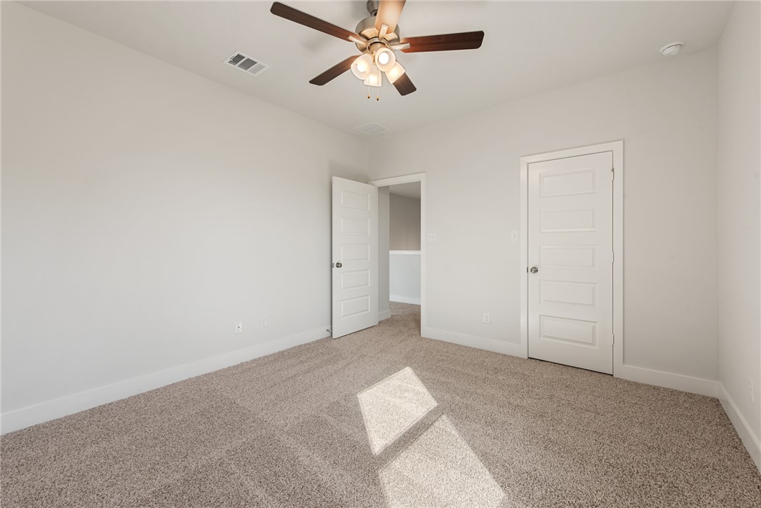8452 Muir Wood Loop Anderson, TX 77830 - Photo 40 of 48 wooden floor in an empty room