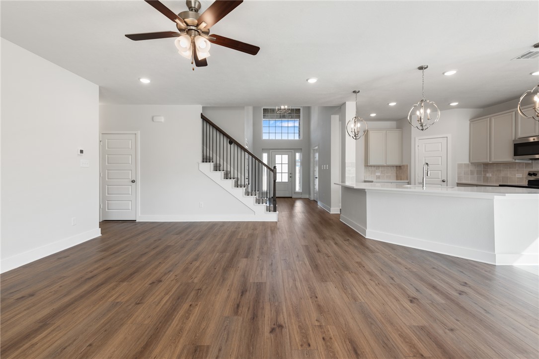 8452 Muir Wood Loop Anderson, TX 77830 - Photo 10 of 48 a view of kitchen with cabinets and wooden floor