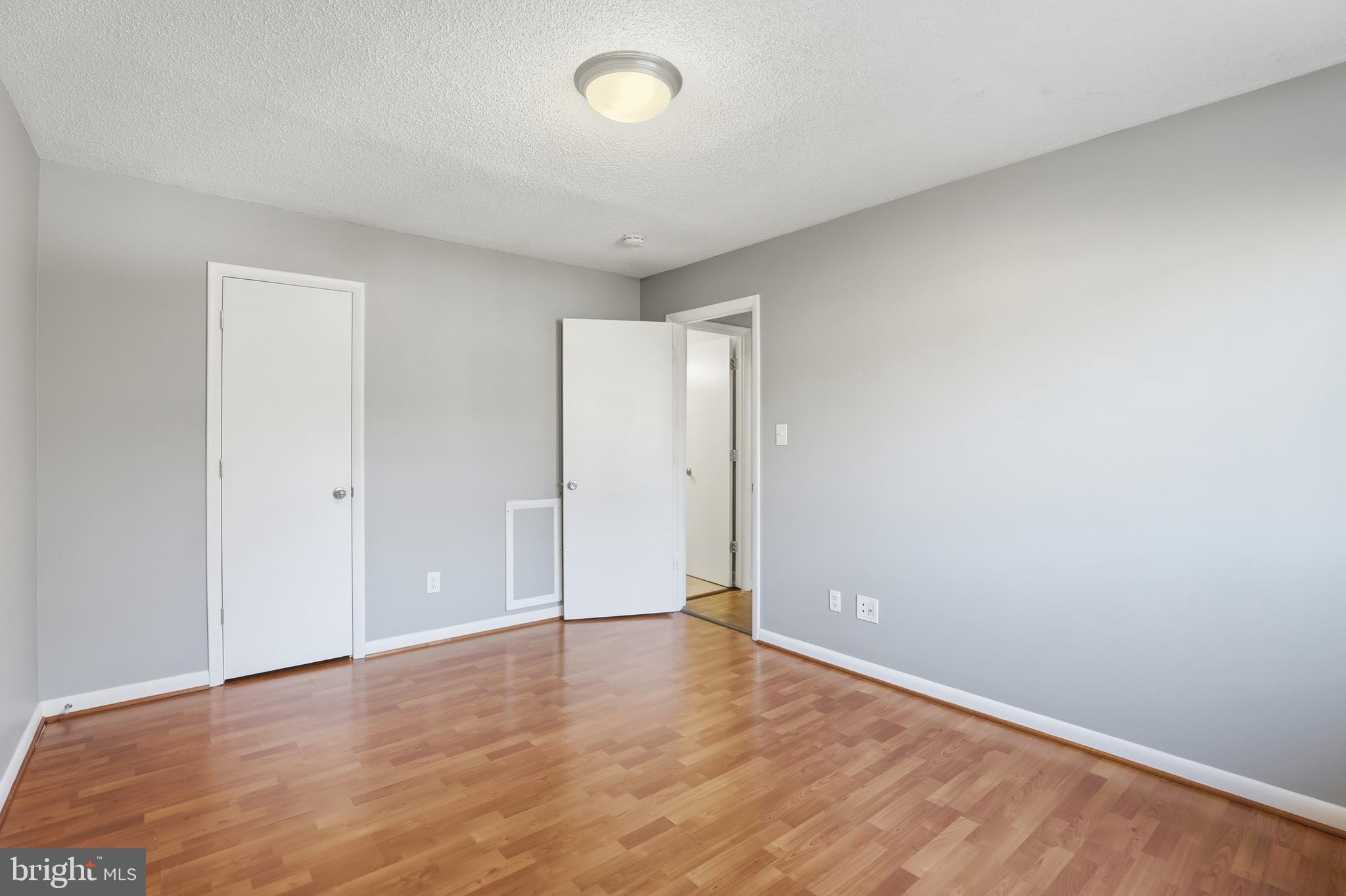 625 Chesapeake Street Southeast, Unit 301 Washington, DC 20032 - Photo 16 of 23 a view of an empty room with wooden floor