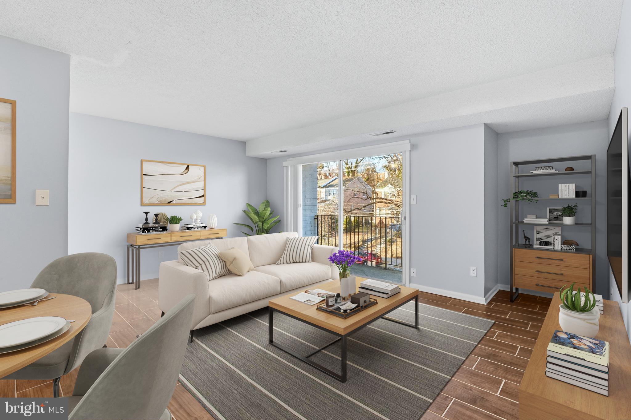 625 Chesapeake Street Southeast, Unit 301 Washington, DC 20032 - Photo 4 of 23 a living room with furniture and a window