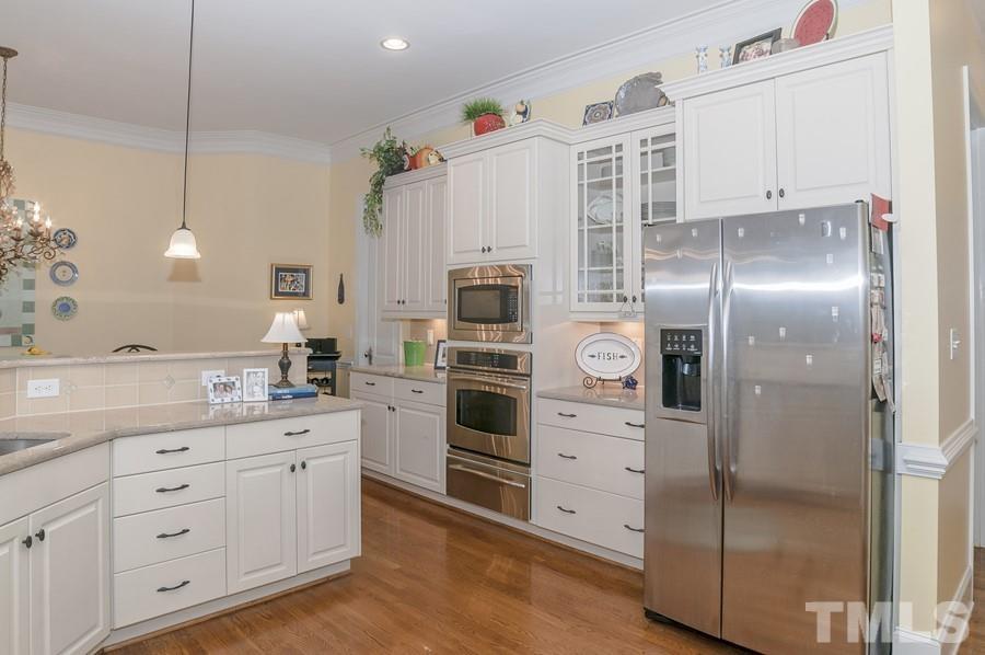 3317 Canoe Brook Parkway Raleigh, NC 27614 - Photo 27 of 67 a kitchen with a refrigerator and a sink