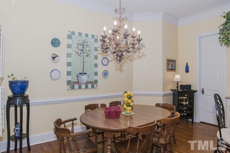 3317 Canoe Brook Parkway Raleigh, NC 27614 - Photo 31 of 67 a view of a dining room with furniture and wooden floor