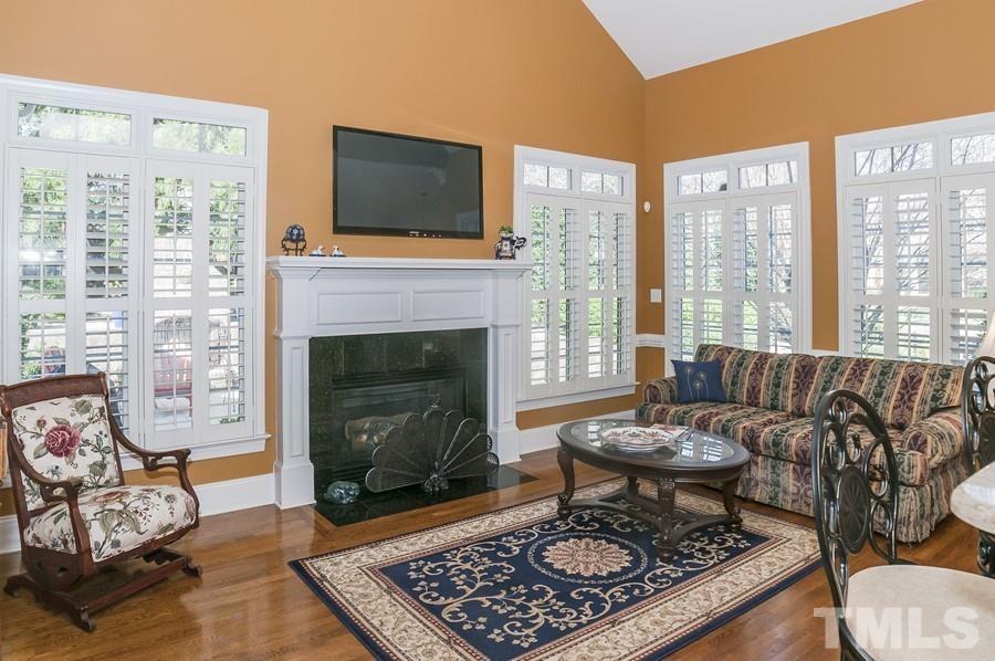 3317 Canoe Brook Parkway Raleigh, NC 27614 - Photo 32 of 67 a living room with furniture and a fireplace