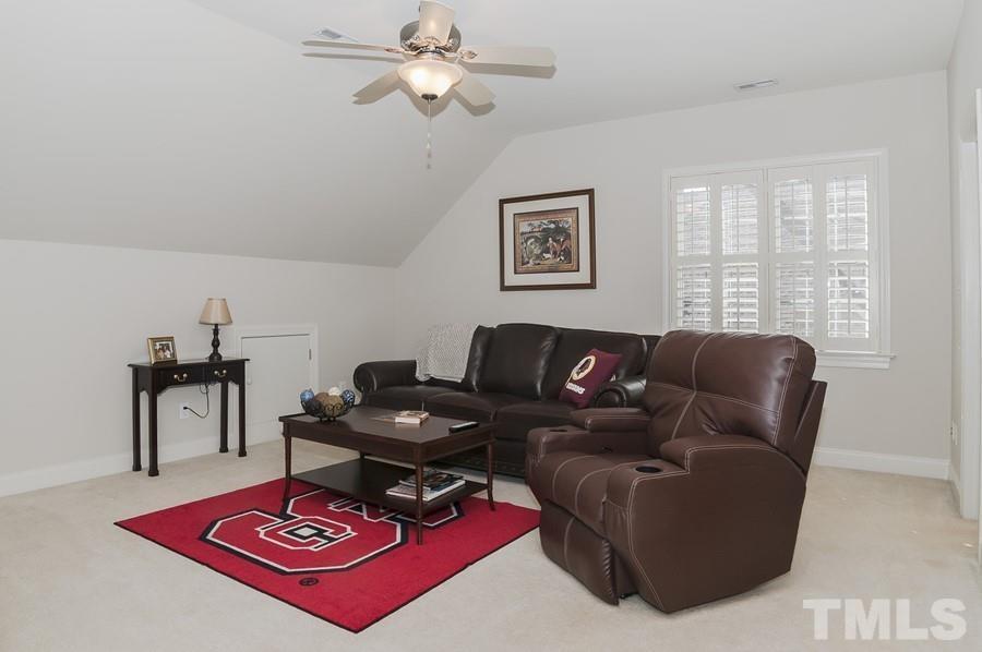 3317 Canoe Brook Parkway Raleigh, NC 27614 - Photo 34 of 67 a living room with furniture a rug and a window