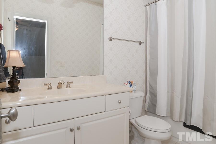 3317 Canoe Brook Parkway Raleigh, NC 27614 - Photo 37 of 67 a bathroom with a sink a toilet and vanity