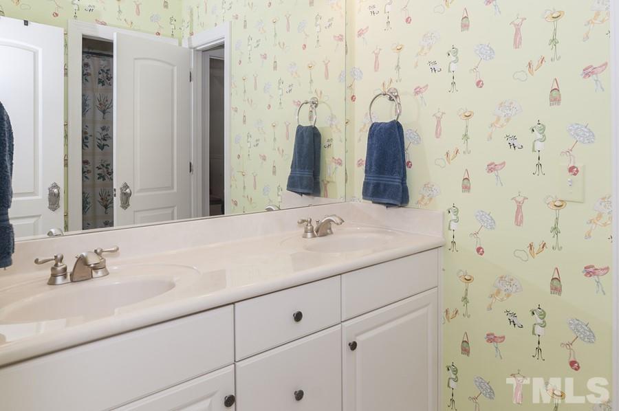 3317 Canoe Brook Parkway Raleigh, NC 27614 - Photo 41 of 67 a bathroom with a sink and a mirror
