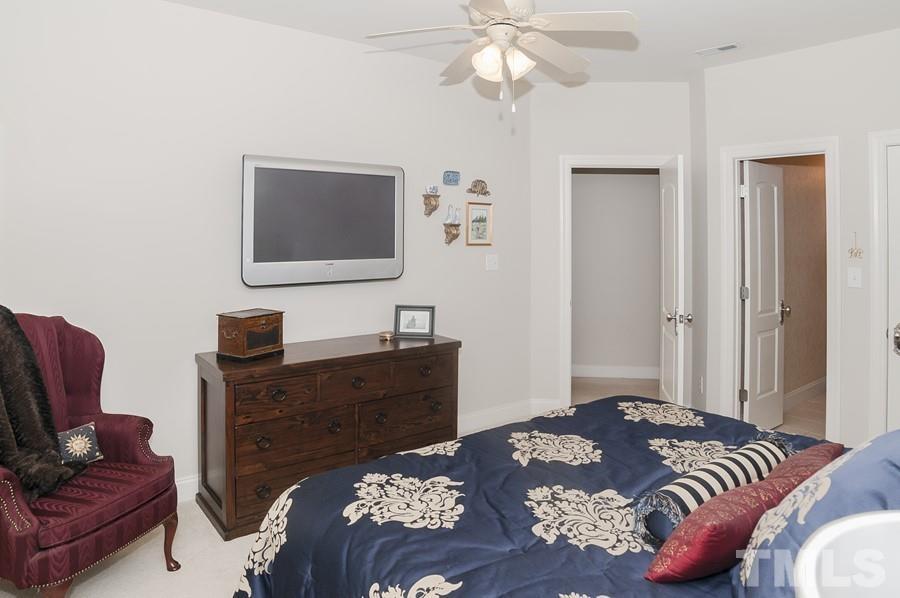 3317 Canoe Brook Parkway Raleigh, NC 27614 - Photo 44 of 67 a bedroom with a bed and furniture