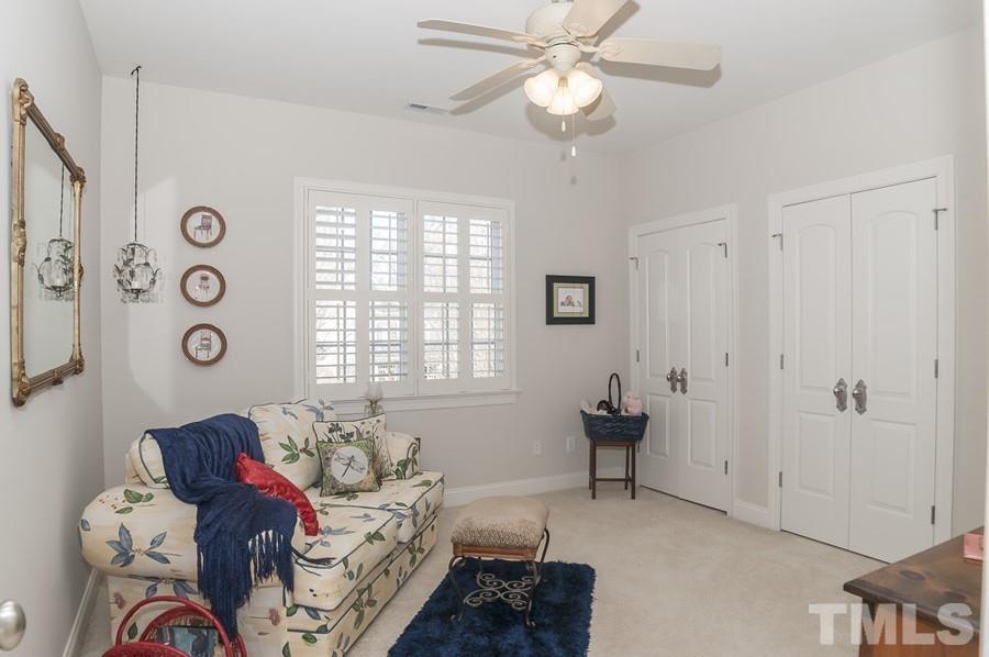 3317 Canoe Brook Parkway Raleigh, NC 27614 - Photo 46 of 67 a living room with furniture and a window