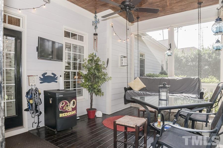 3317 Canoe Brook Parkway Raleigh, NC 27614 - Photo 51 of 67 a view of a patio with table and chairs potted plants with wooden floor