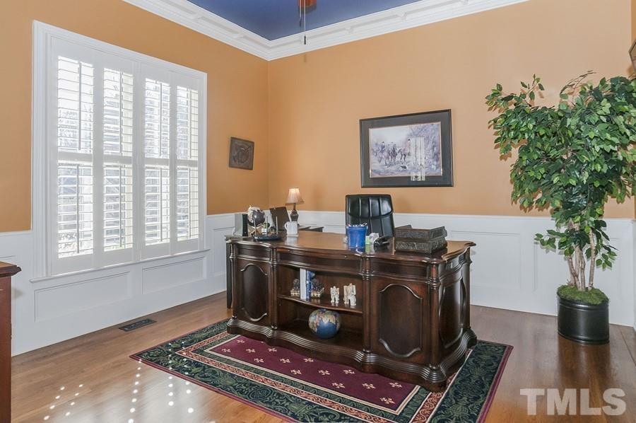 3317 Canoe Brook Parkway Raleigh, NC 27614 - Photo 6 of 67 a view of a workspace with furniture and a potted plant