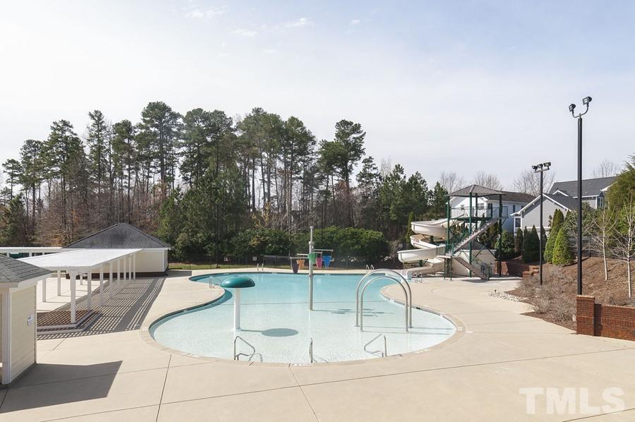 3317 Canoe Brook Parkway Raleigh, NC 27614 - Photo 65 of 67 a view of a swimming pool with a patio and a garden