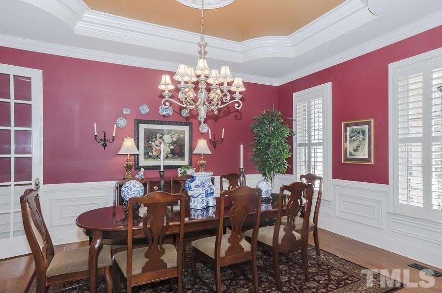 3317 Canoe Brook Parkway Raleigh, NC 27614 - Photo 9 of 67 a view of a dining room with furniture and chandelier