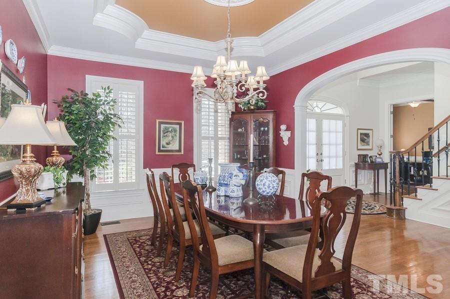 3317 Canoe Brook Parkway Raleigh, NC 27614 - Photo 10 of 67 a view of a dining room with furniture and chandelier
