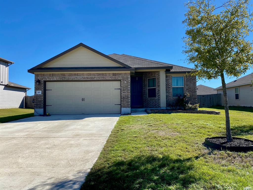 149 Red Sun Drive Kyle, TX 78640 - Photo 1 of 18 a front view of a house with a yard