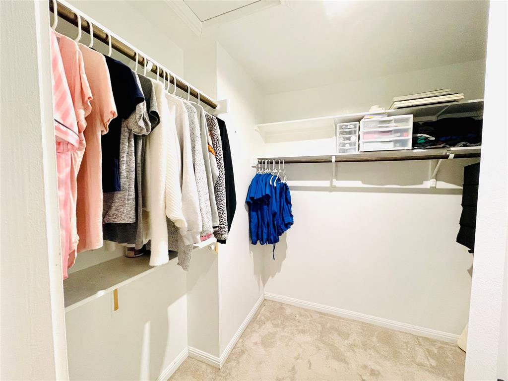 149 Red Sun Drive Kyle, TX 78640 - Photo 11 of 18 a view of walk in closet with clothes and shoes