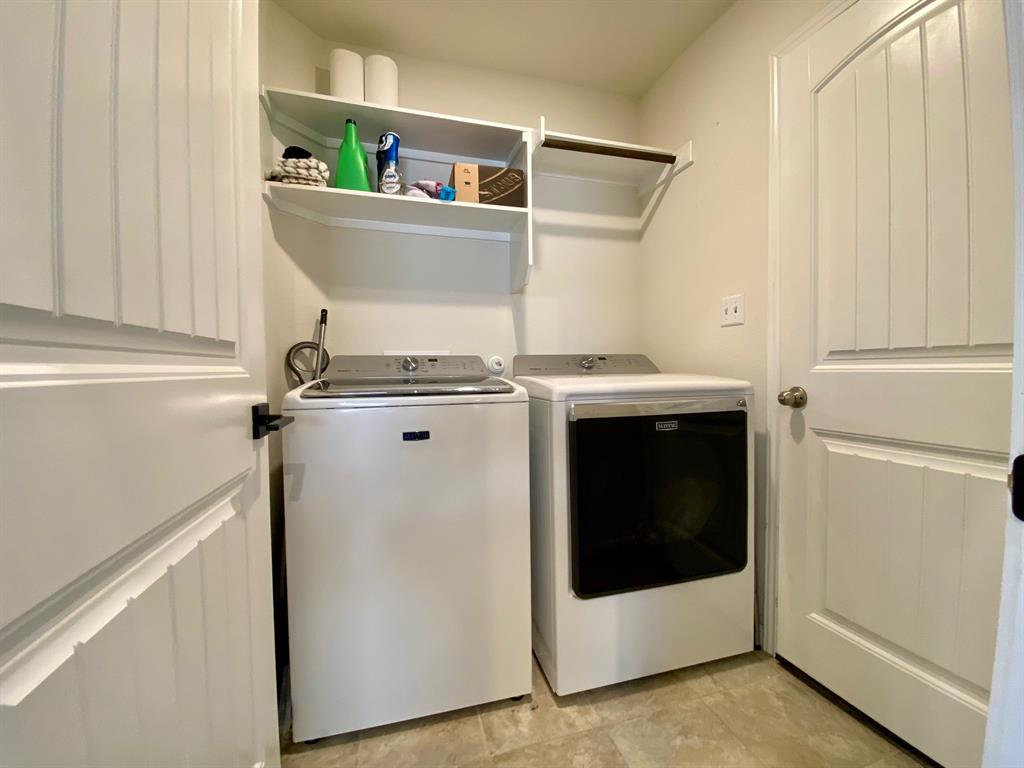 149 Red Sun Drive Kyle, TX 78640 - Photo 15 of 18 a utility room with dryer and washer