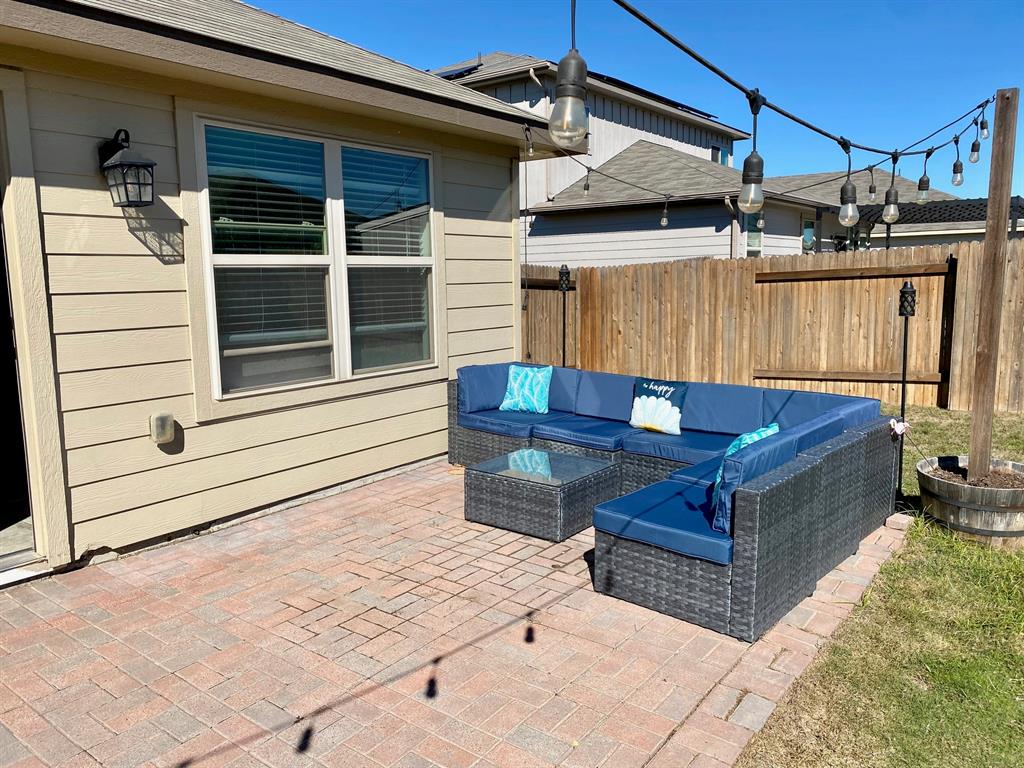149 Red Sun Drive Kyle, TX 78640 - Photo 16 of 18 a view of a patio with a table and chairs