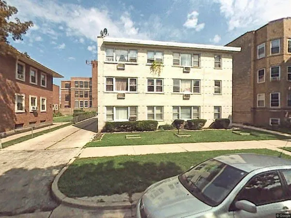 a view of a building with backyard
