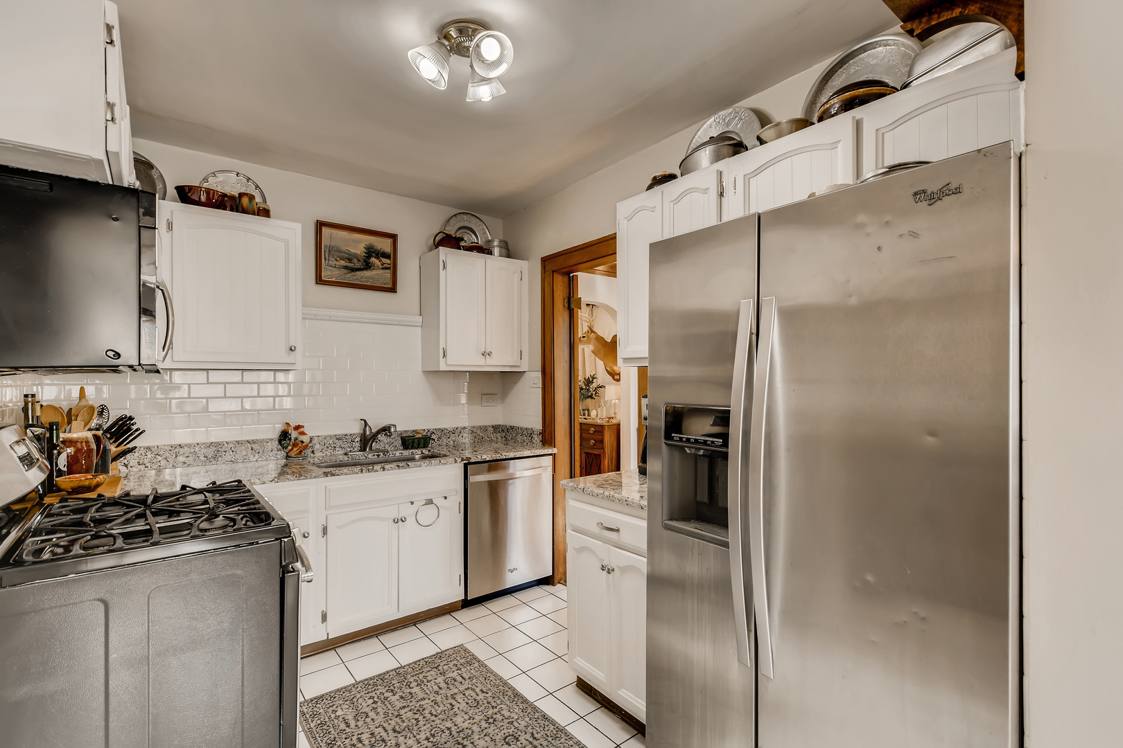 338 Northwood Road Riverside, IL 60546 - Photo 12 of 30 a kitchen with stainless steel appliances granite countertop a refrigerator and a sink