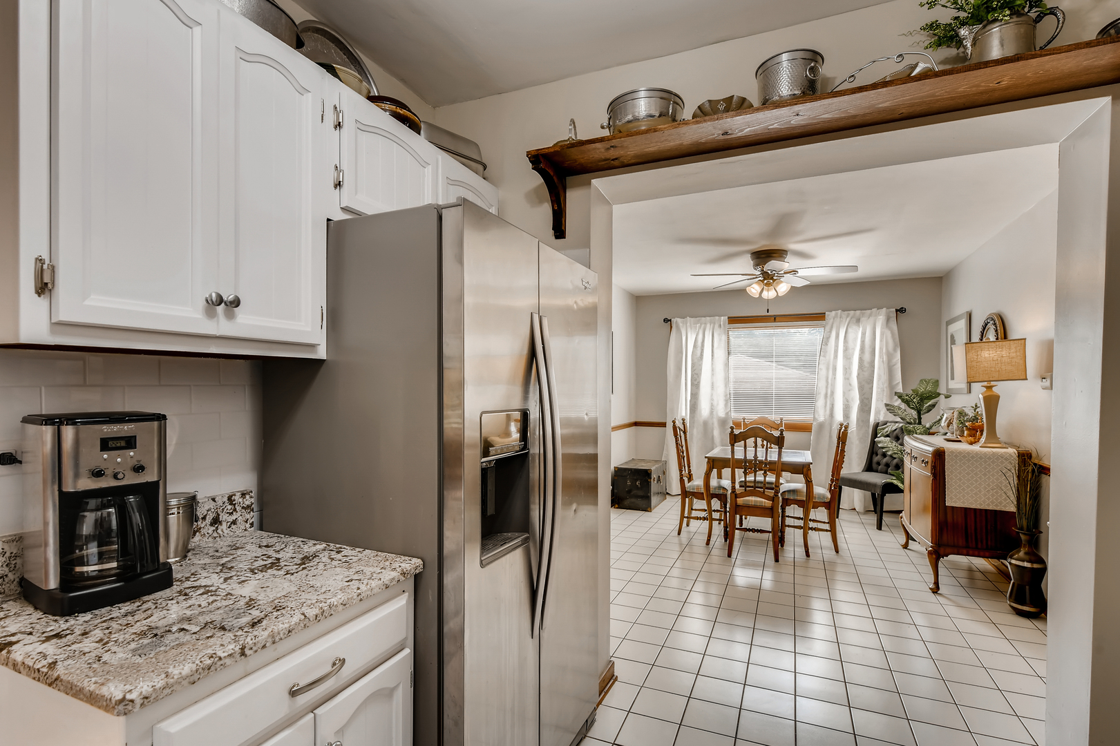 338 Northwood Road Riverside, IL 60546 - Photo 14 of 30 a kitchen with stainless steel appliances granite countertop a refrigerator and cabinets