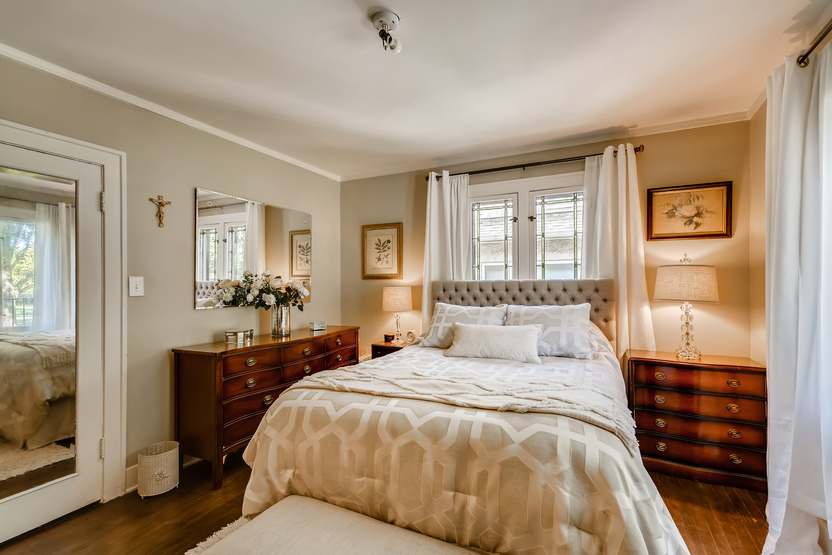 338 Northwood Road Riverside, IL 60546 - Photo 18 of 30 a bedroom with a large bed and a chandelier