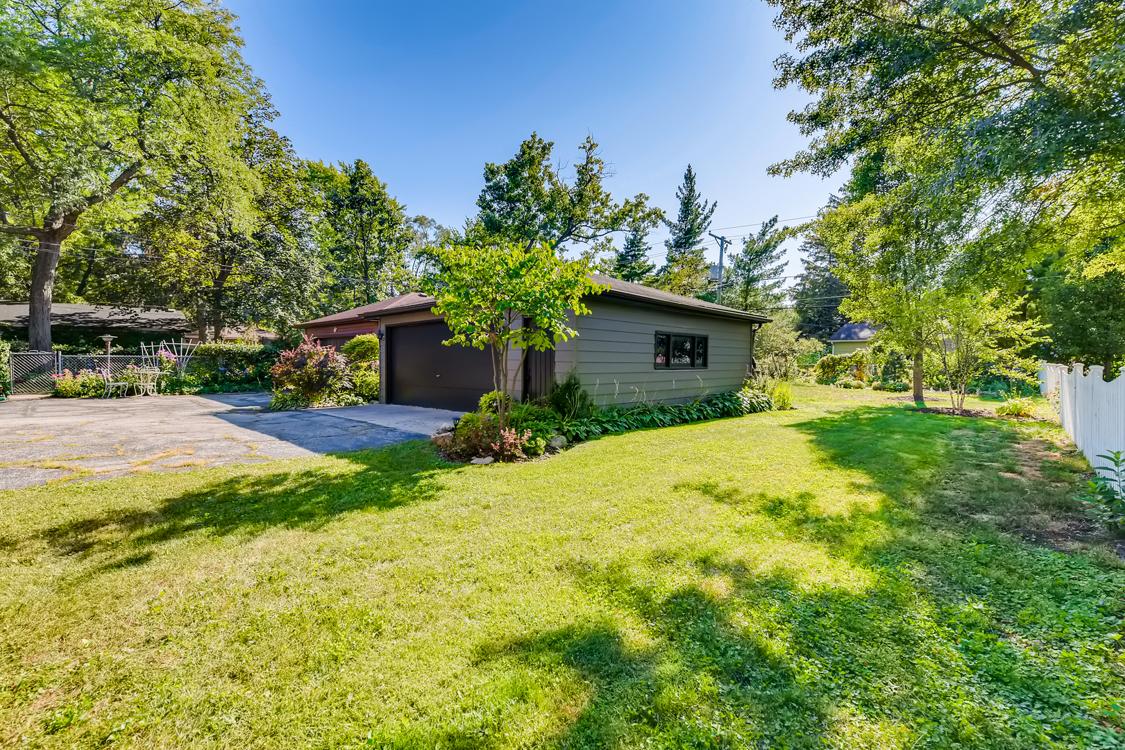338 Northwood Road Riverside, IL 60546 - Photo 28 of 30 a yellow house with trees in front of it