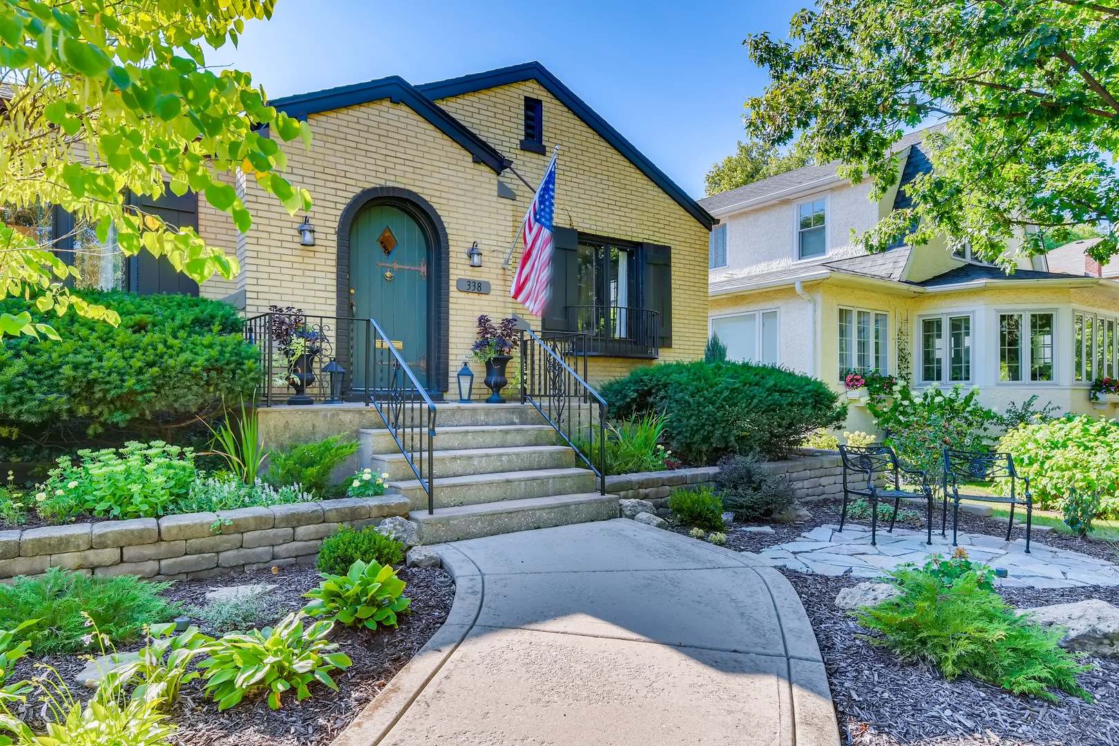 338 Northwood Road Riverside, IL 60546 - Photo 3 of 30 a front view of a house with a garden