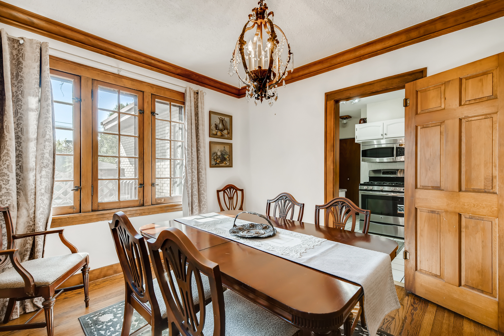 338 Northwood Road Riverside, IL 60546 - Photo 10 of 30 a view of a a dining room with furniture window and wooden floor