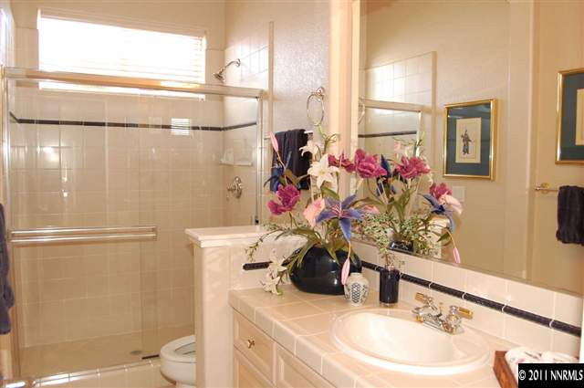 740 Sandoval Road Reno, NV 89511 - Photo 11 of 13 a bathroom with a sink toilet and shower