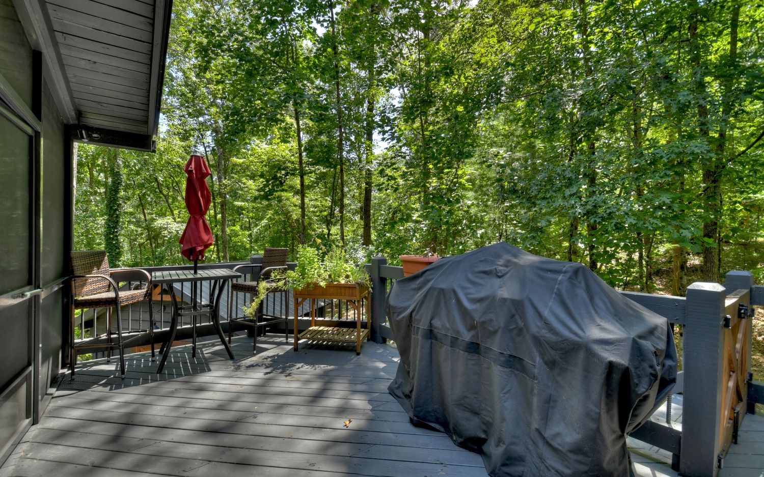 31 Redbird Trail Blue Ridge, GA 30513 - Photo 46 of 70 a view of deck and patio with table and chairs a barbeque with wooden floor and fence