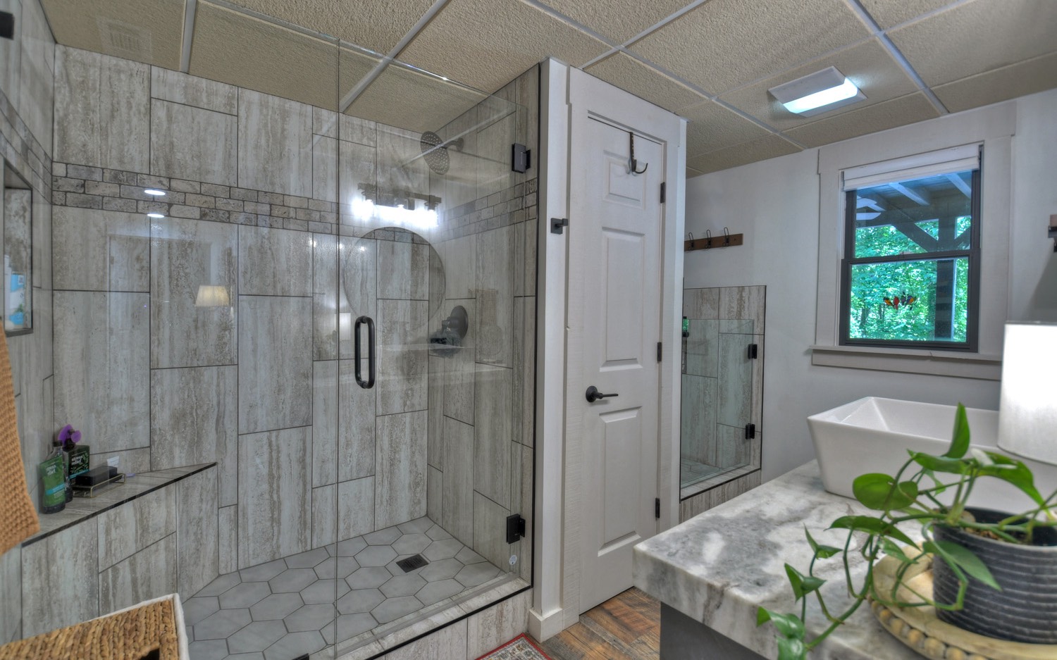 31 Redbird Trail Blue Ridge, GA 30513 - Photo 61 of 70 a bathroom with a shower and a sink