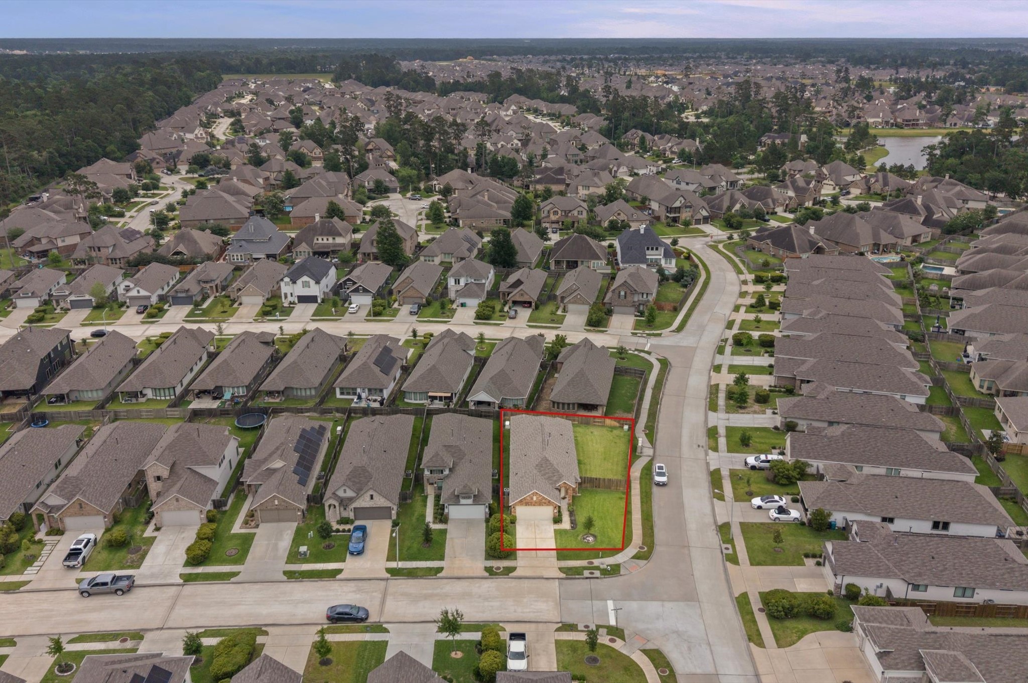 2702 Meadow View Lane Conroe, TX 77385 - Photo 24 of 26 an aerial view of a house with a yard
