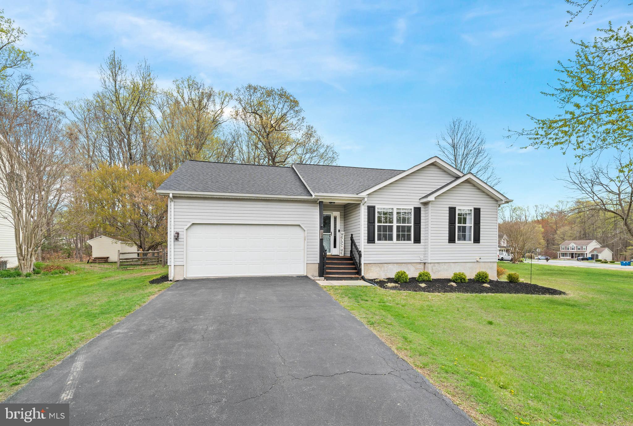 110 Winfield Drive Elkton, MD 21921 - Photo 2 of 50 a front view of a house with a yard and garage