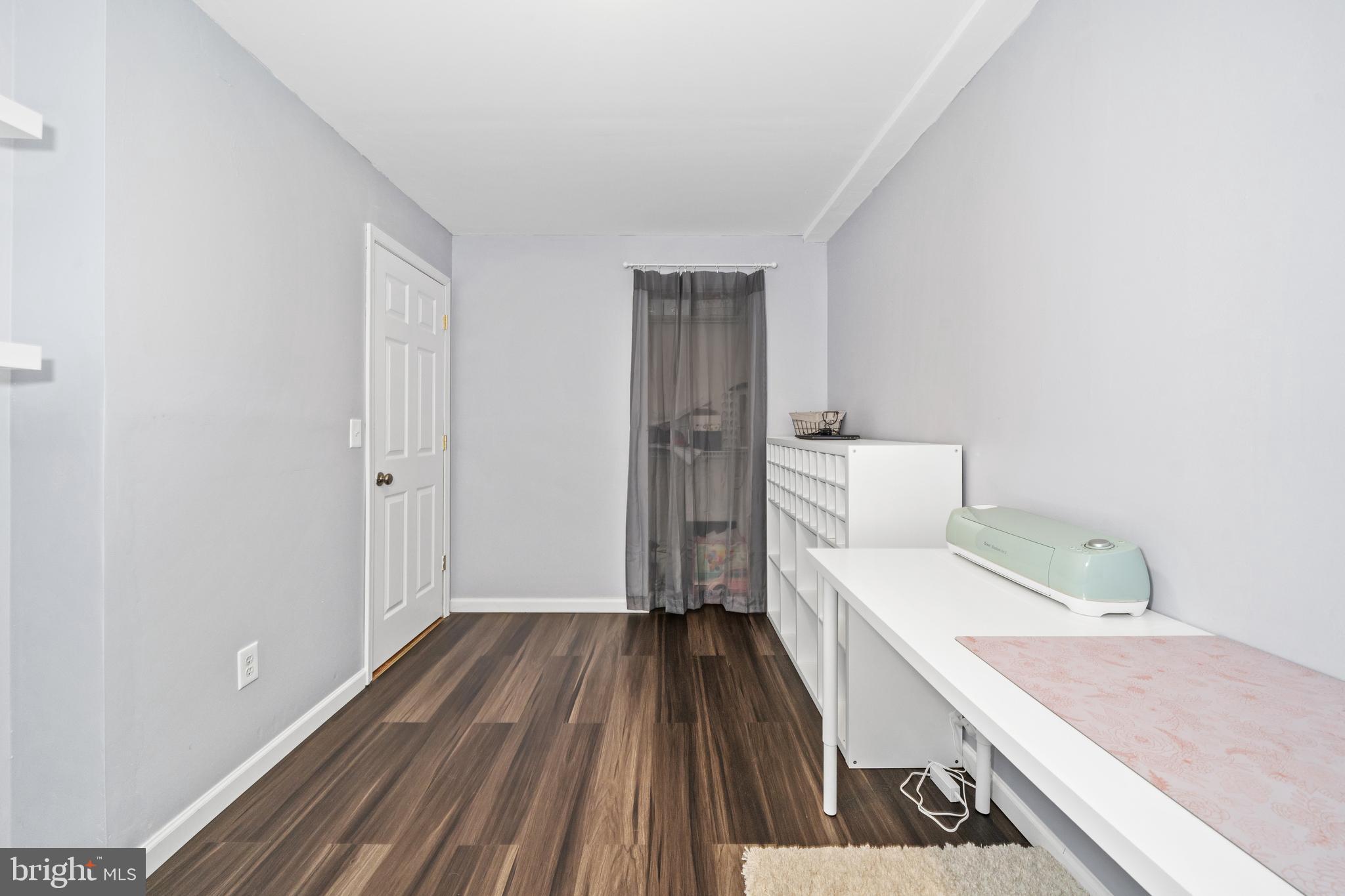 110 Winfield Drive Elkton, MD 21921 - Photo 46 of 50 a room with a bed and wooden floor