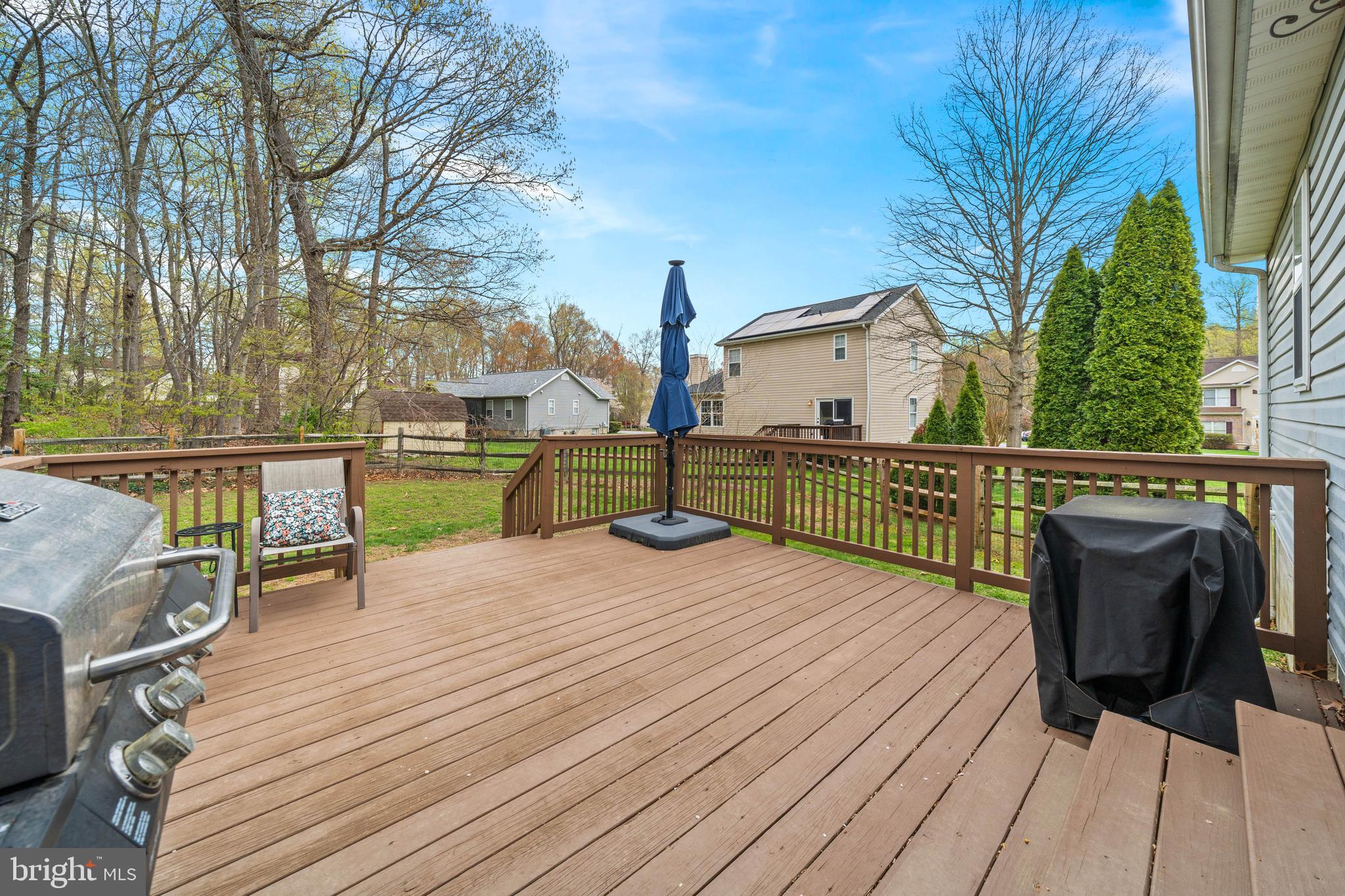 110 Winfield Drive Elkton, MD 21921 - Photo 10 of 50 a view of a deck with chairs next to a yard