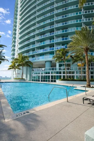 a view of a building with a yard