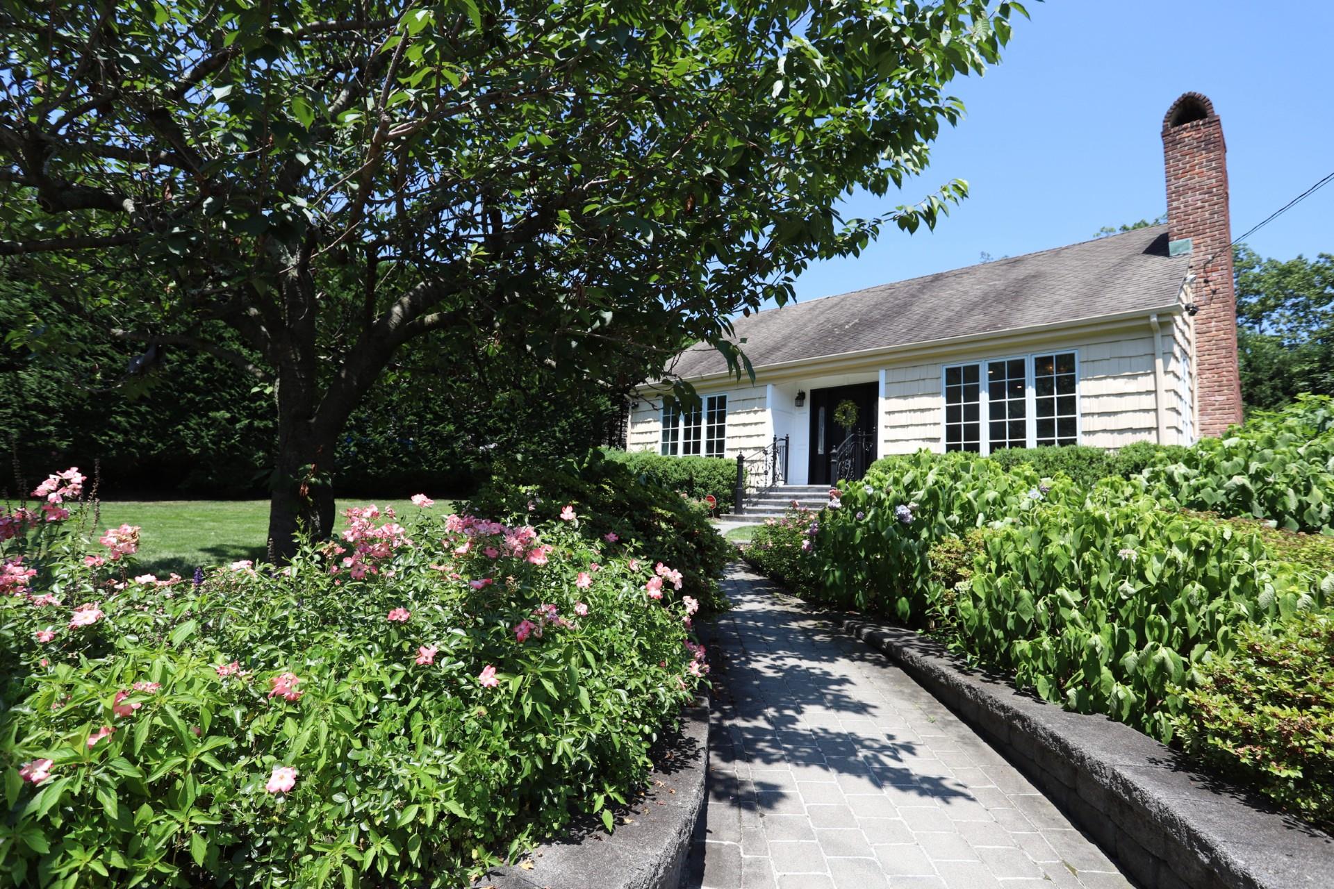 View of front of property featuring a chimney