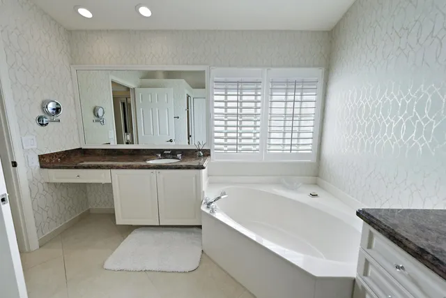 a living room with patio furniture and garden