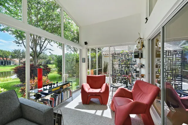 a view of a lake with a house in the background