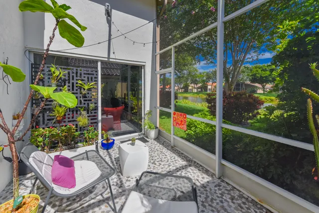 a view of a lake with houses in the back