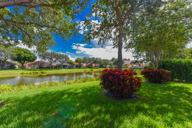 an aerial view of residential house with outdoor space and swimming pool