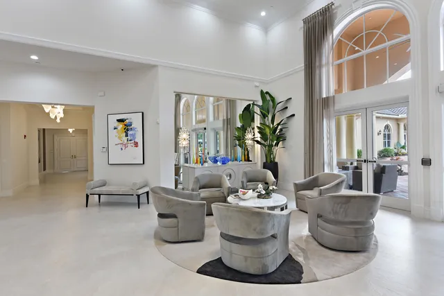 a living room with furniture cabinets and window