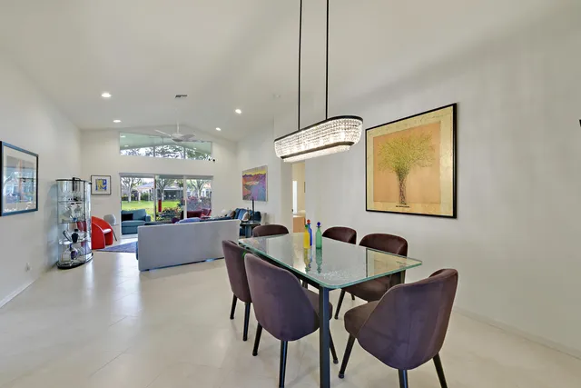 a kitchen with a table and chairs in it