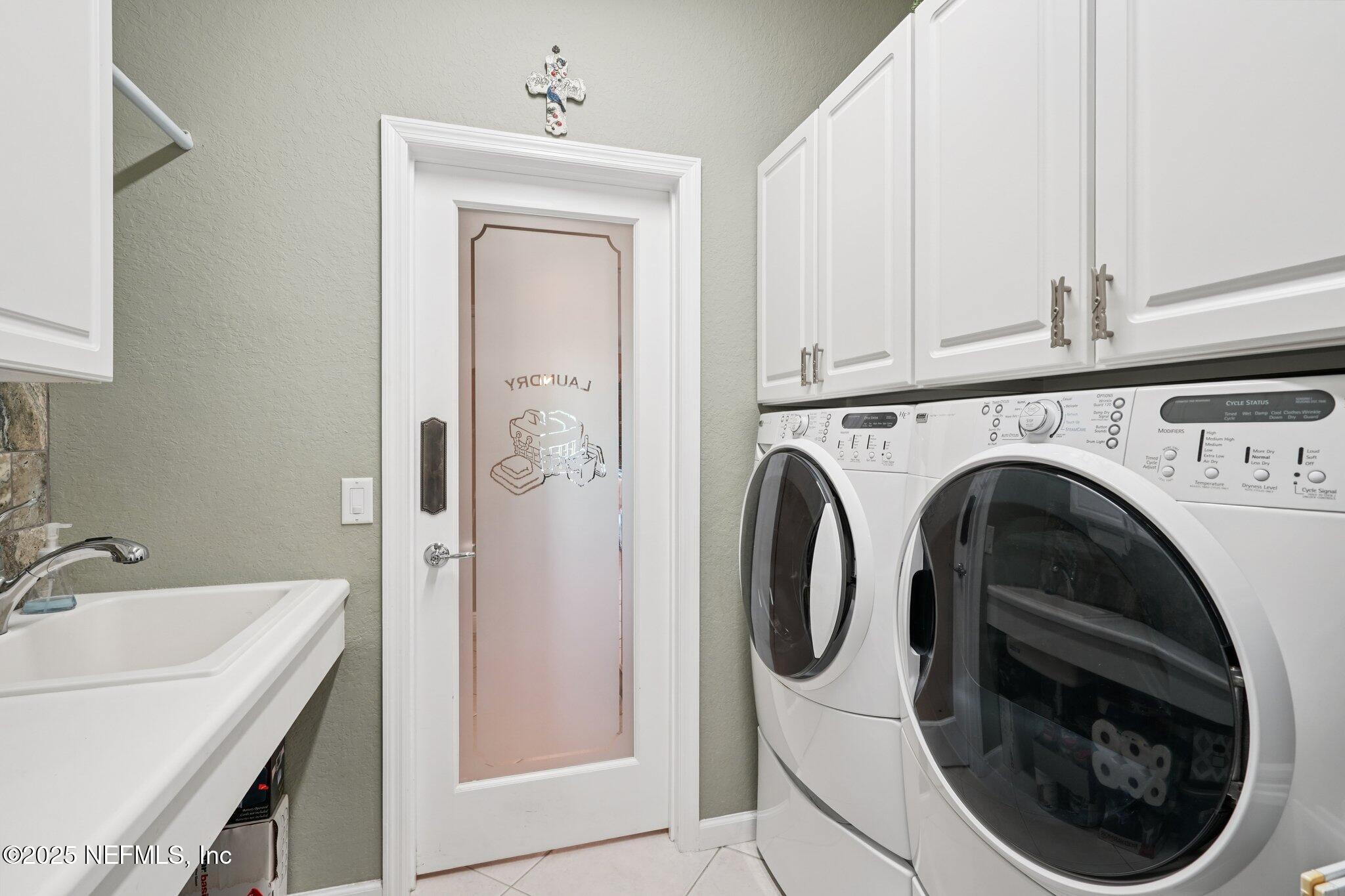 9839 Southwest 63rd Loop Ocala, FL 34481 - Photo 18 of 43 Laundry with sink and storage
