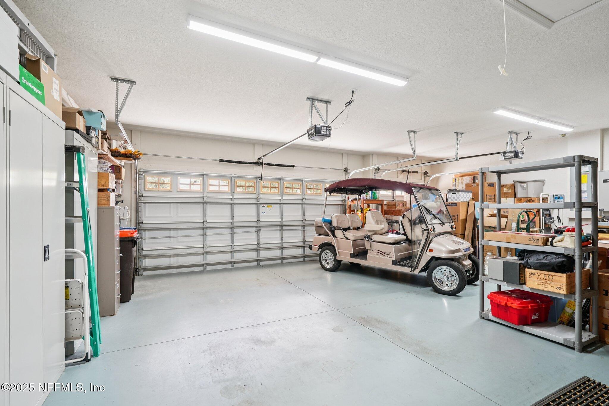 9839 Southwest 63rd Loop Ocala, FL 34481 - Photo 20 of 43 Garage with storage