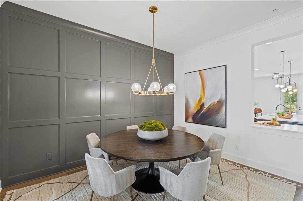3440 Commander Cove Suwanee, GA 30024 - Photo 17 of 49 a view of a dining room with furniture and chandelier