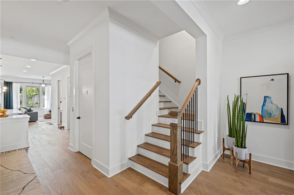 3440 Commander Cove Suwanee, GA 30024 - Photo 19 of 49 a view of entryway with wooden floor and furniture